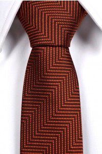 The Darren necktie has a more complex pattern and a deeper orange